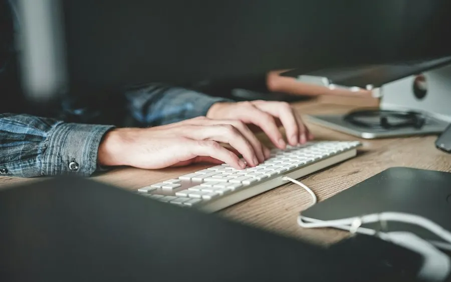 Hands navigating with a computer keyboard