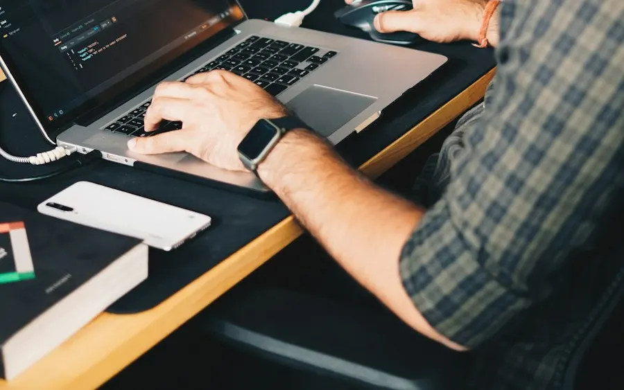 Tester working through test cases on a laptop